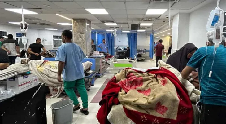 Israeli forces stand at the entrance of Gaza's primary hospital, where hundreds are confined.