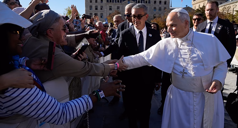 French President Emmanuel Macron welcomes Pope Leo XIV at the Élysée Palace