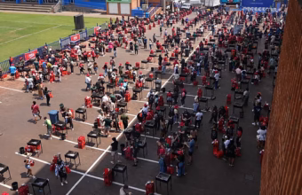 Participants gathered around grilling stations during a mass barbecue in Pretoria