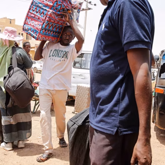 Sudanese refugees arriving at a transit centre in eastern Chad