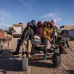 Sudanese refugees arriving at a transit centre in eastern Chad