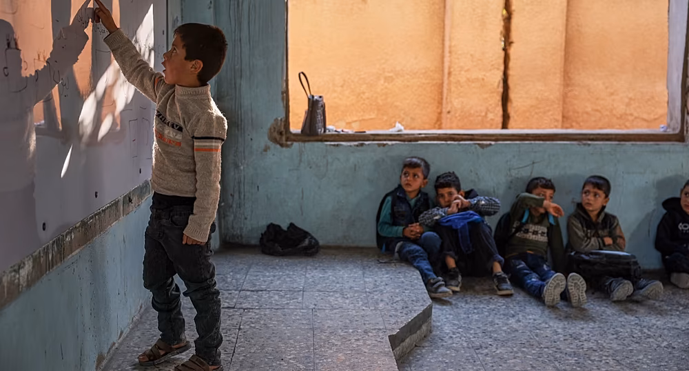 Syrian children returning to school amid damaged buildings in Damascus