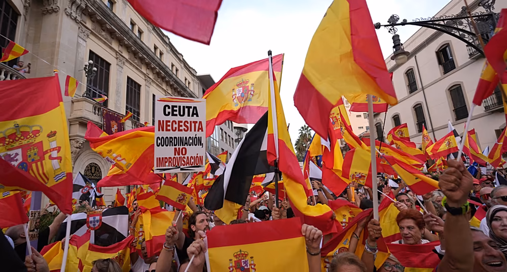 Protesters marching from Cibeles Square toward the Moncloa Arch during a demonstration over the Ceuta migration crisis