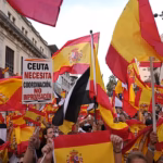 Protesters marching from Cibeles Square toward the Moncloa Arch during a demonstration over the Ceuta migration crisis