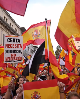 Protesters marching from Cibeles Square toward the Moncloa Arch during a demonstration over the Ceuta migration crisis