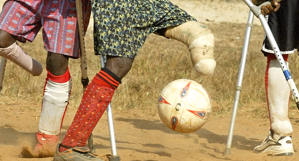 Amputee football players competing with crutches during a tournament in Uvira, Democratic Republic of the Congo