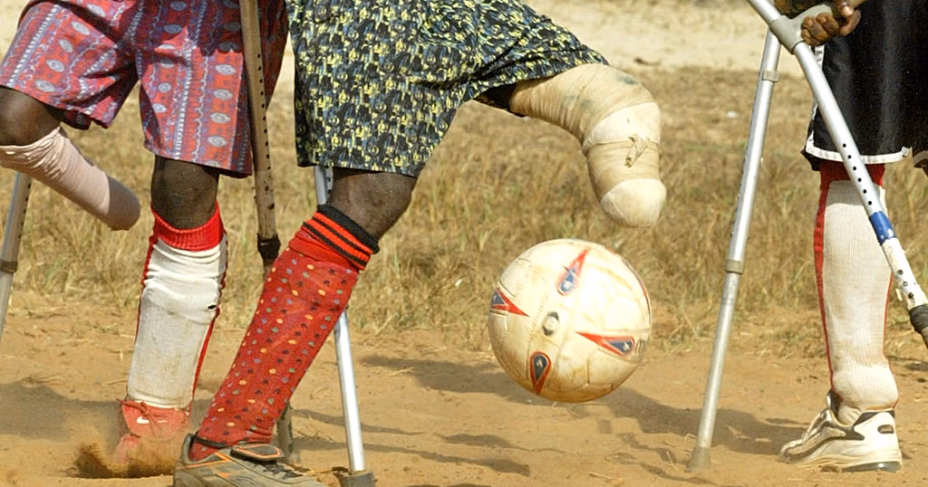 Amputee football players competing with crutches during a tournament in Uvira, Democratic Republic of the Congo