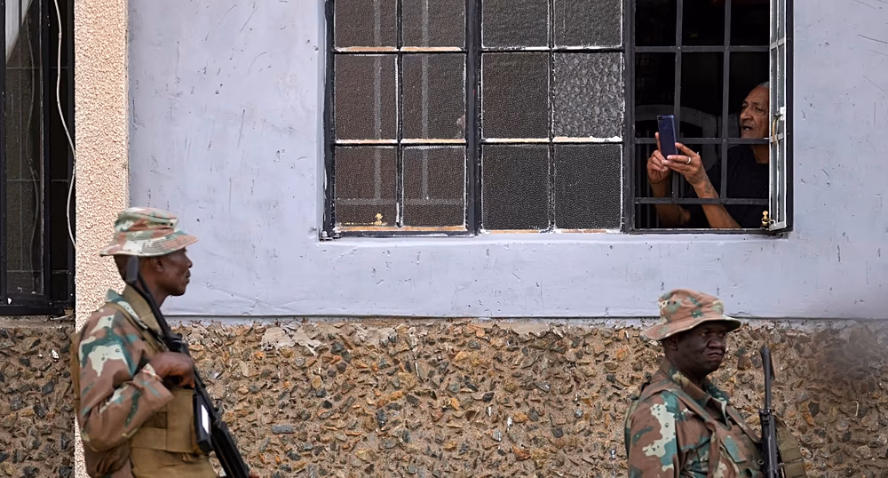 Police and soldiers deployed after a deadly shooting in Wedela, South Africa