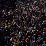 Protesters gather during a demonstration in Durban against undocumented immigration and gender-based violence