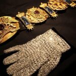 Michael Jackson’s rhinestone-covered glove and red leather Thriller jacket listed for auction